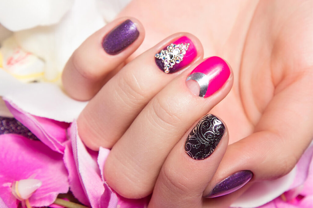 Beautiful colorful manicure with bubbles and crystals