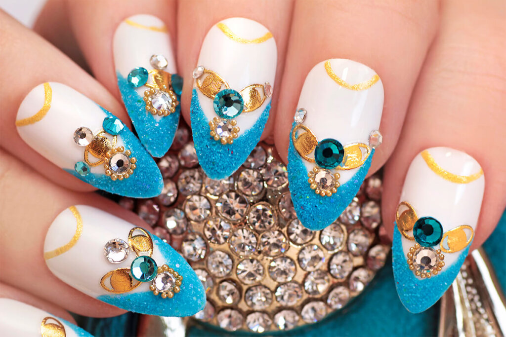 a hand with blue and white nails