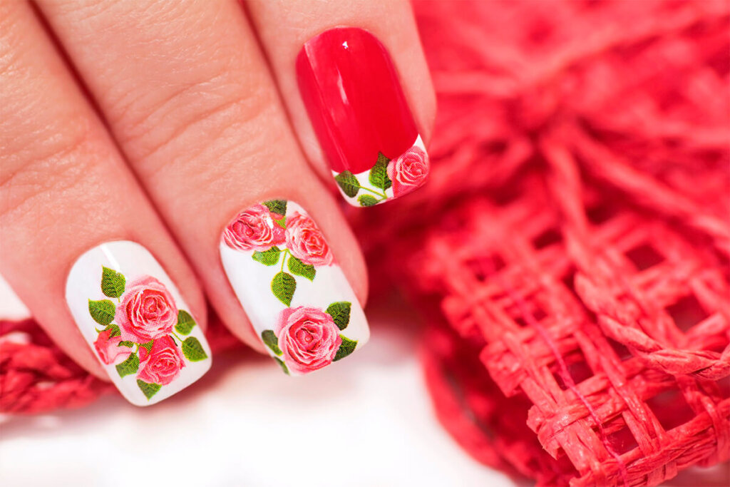 a painted fingernails with flowers on them